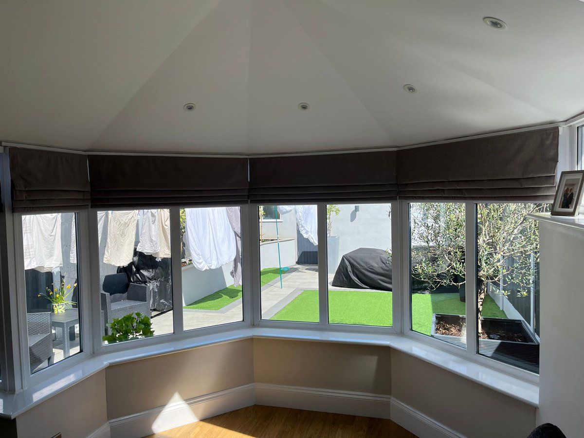 Wave Curtains with matching metropole and a backdrop of Roman Blinds to fill this customers conservatory. Roman Blinds are known for their classic, sophisticated appearance, with soft fabric folds. Wave Curtains offer a modern and sleek appearance throughout the Curtain drop.