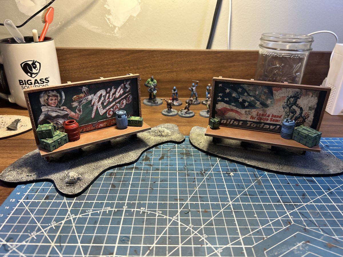 Two more billboards completed and ready for the table, no onto some larger terrain projects.  I lasercut the billboard frames myself and printed the signs from the internet.  The barrels and crates are from purchased 3D print files.

#FalloutWastelandWarfare @Modiphius  @Cults3D