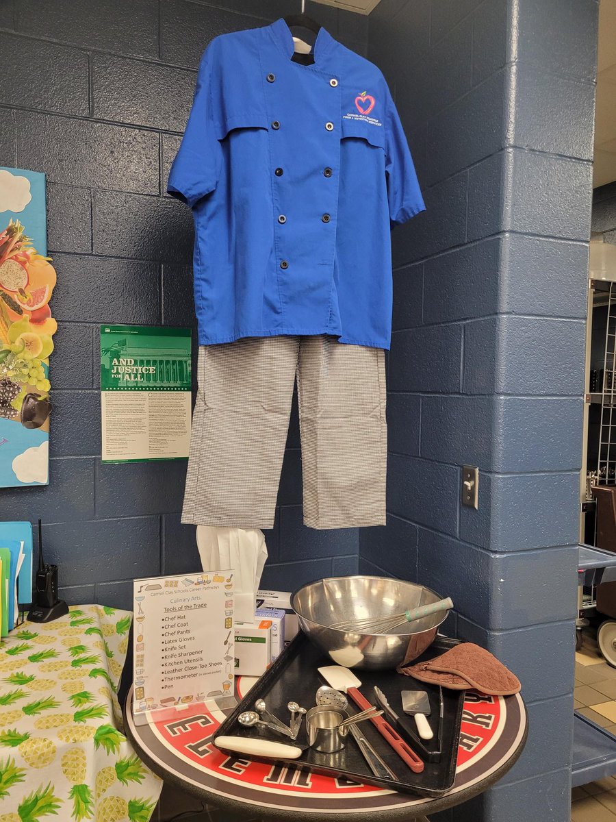 The cafeteria staff at West Clay have created displays in the serving area showing the uniforms &amp; tools used by 4 of the various professions taught at CHS! Culinary Arts, Construction Trades, EMT, and Nursing. The attached blurbs are being read by Mrs. Schipp each morning!