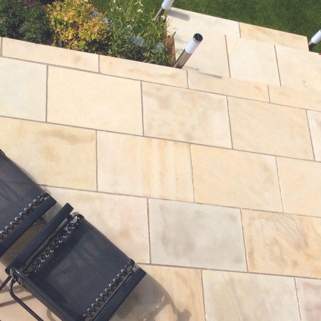 Natural Paving's sandstone melds beauty and durability, offering a timeless landscape enhancement with its smooth texture and modern appeal. Its even surface ensures functionality for spaces needing consistent aesthetics. #landscapingideas #ivory #inspiration