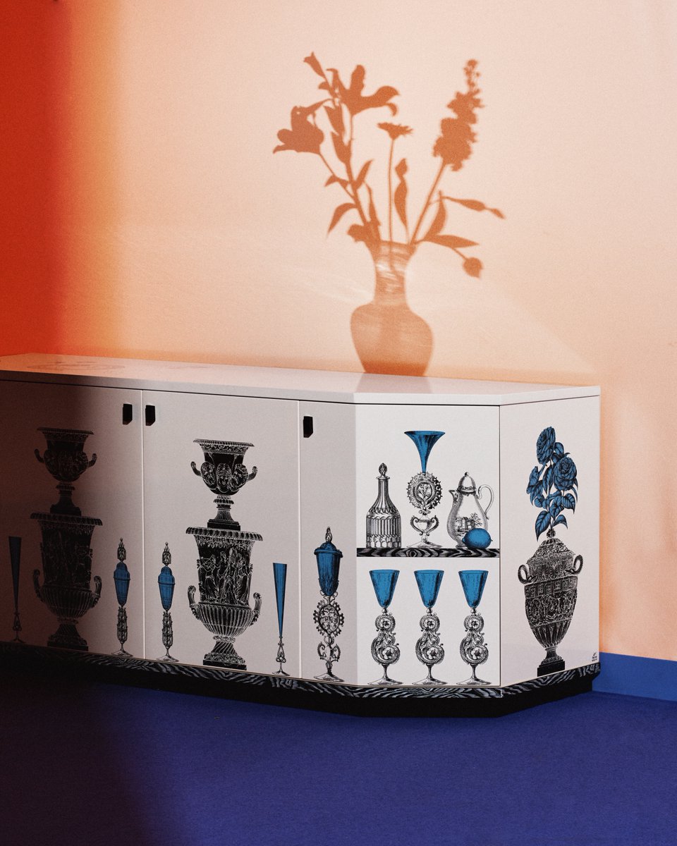 Introducing the Buffet Polyhedric for the ultimate mise en place. Enhanced by Fornasetti's graphic style and dreamlike language, the “Vasi” décor creates a dialogue with the dining room, mixing container and contained. #Fornasetti #milandesignweek #MDW24