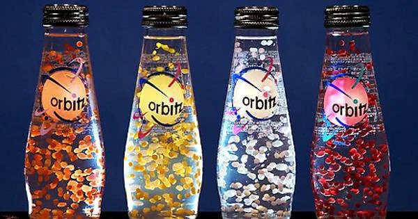 Orbitz (1996-1998): A line of clear, non-carbonated beverages, filled with dozens of tiny, suspended balls of what was essentially gelatin. Came in Raspberry Citrus, Blueberry Melon Strawberry, Pineapple Banana Cherry Coconut, Vanilla Orange, Black Currant Berry, and Chocolate