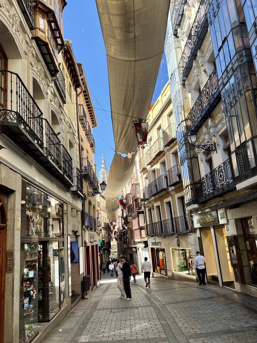 Toledo Spain day trip from Madrid today. Interesting to see long pieces of canvas hanging above many of the most narrow streets. I read that they are meant to provide shade, but they also make these scenic streets even more visually interesting