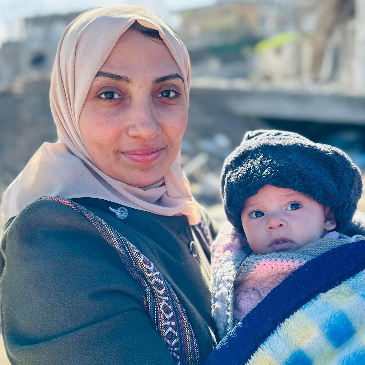 Israel's military kills journalist and author Amina Hmeid along with her child in a strike on her house in Al Shate' refugee camp in western Gaza.