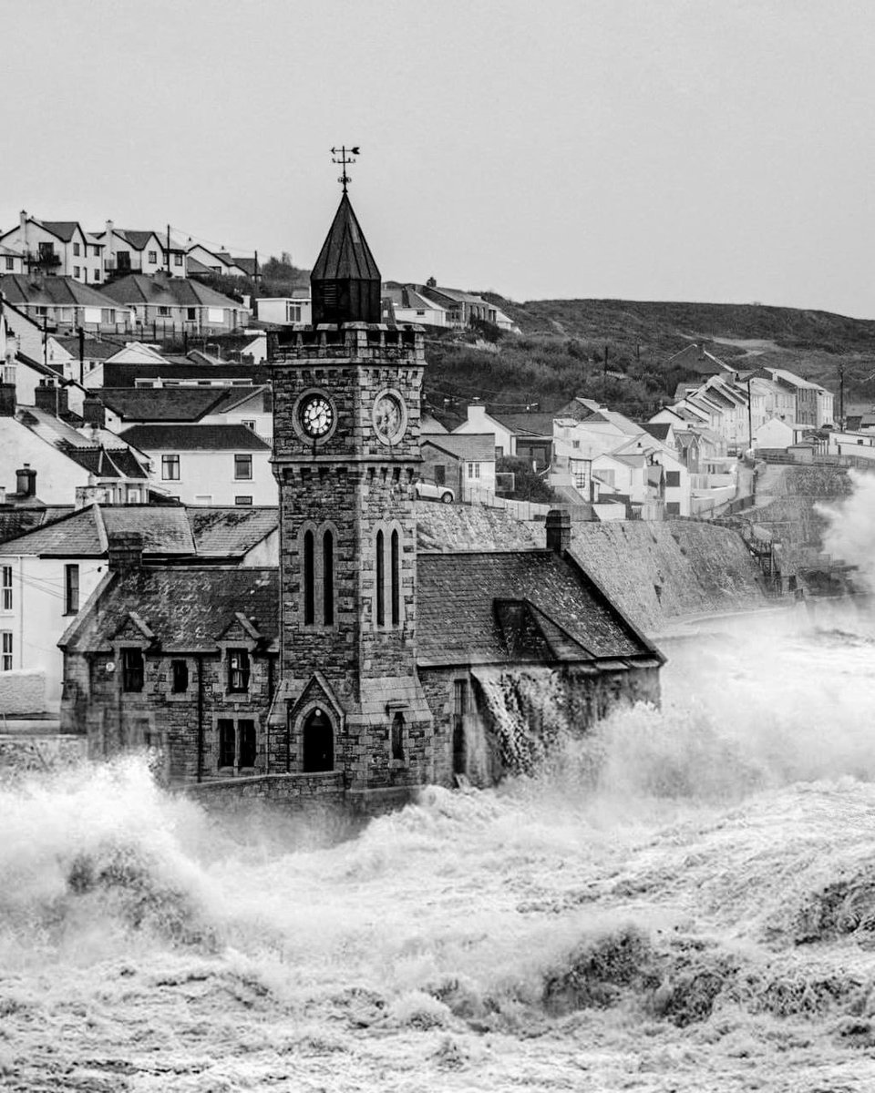 A Photograph taken at high tide, with strong gales and waves spraying  over the 70ft tall Porthleven Clock Tower in Cornwall.