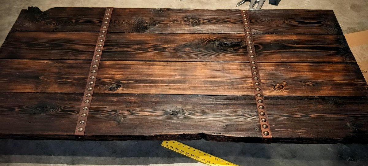 Papat0k's tweet photo. Did some prop building for this weekend when @TheEdVerse comes down to record ≈ 20 new #realmslore vids

Went for "well-used tavern table" and I think it hits the brief. At least 2 of those boards are >100 years old

Burned, poly'd/waxed, and tacked/studded leather accents https://t.co/0DsbIjr78P