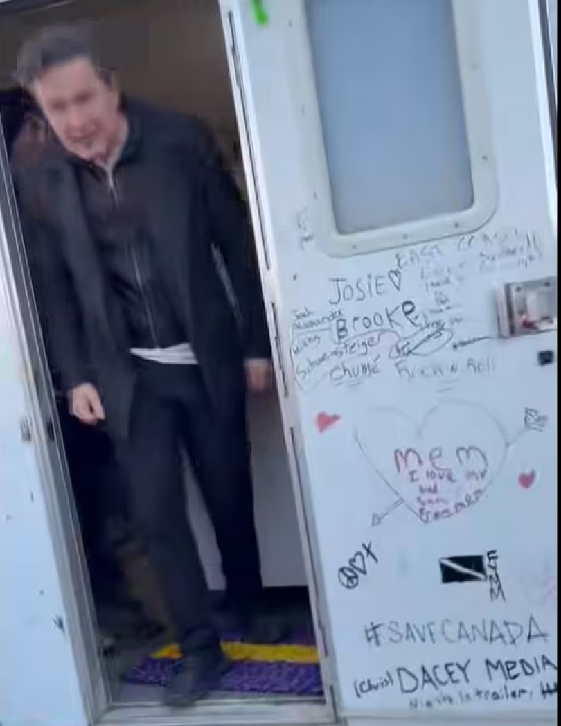Poilievre is seen leaving a RV with a drawing of the Diagolon flag on the door. According to RCMP, Diagolon is a militia-like network whose supporters subscribe to an 'accelerationist' ideology - the idea that a civil war or the collapse of western governments is inevitable and