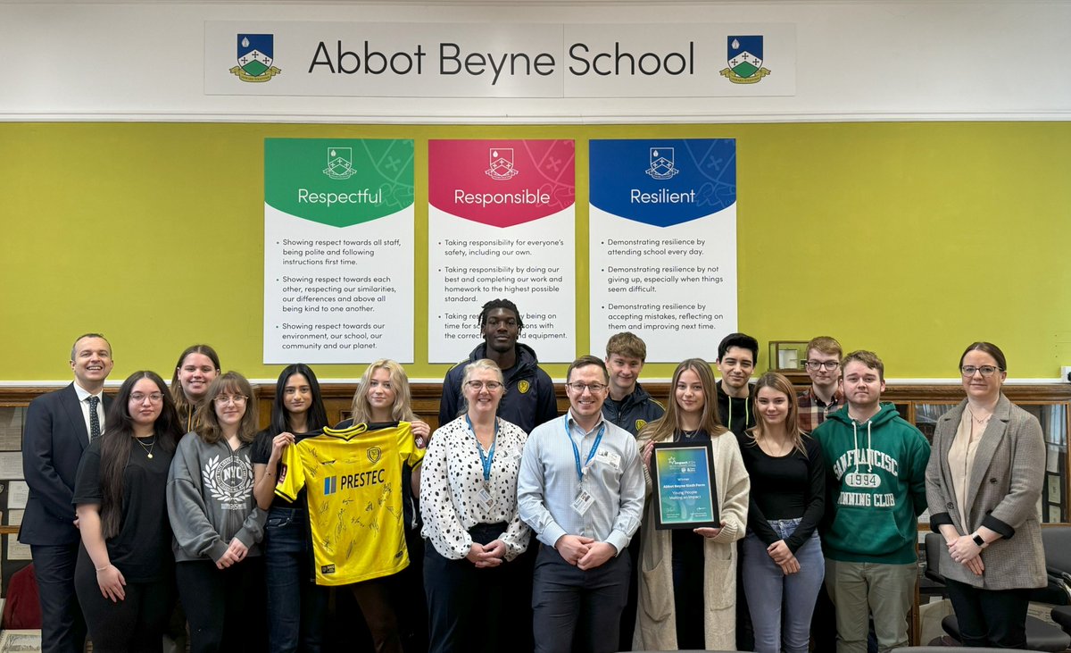 Another wow - we have been gifted a signed @BAFCAcademy shirt for our positive impacts with the local community.  Will Tamen and Dylan Scott, scholars from the Burton Albion Academy, presented the shirt to Abbot Beyne School. @abbotbeyne @OnwardTogether @Trentanddove