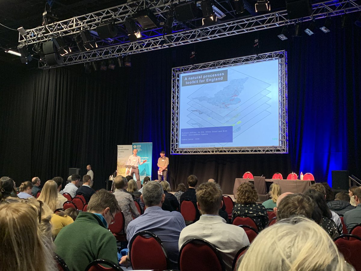 Rich and Ollie from our national team on stage discussing their work producing a Natural Processes Toolkit. The tools apply data to tackle physical modification of river catchments and understand climate risks. #RRCConference