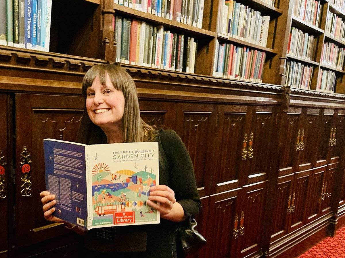 Super geeky post alert 🚨 I was just walking down a corridor in the House of Lords looking at the books & what did I see…? My book co-written with the wonderful @Katy_Lock & @HughEllisTCPA So cool there’s a copy of The Art of Building a Garden City in the Lords Library 🤓📚