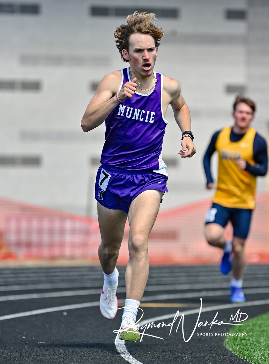 Muncie Central Distance Runner Senior Gabe Reynolds rounds turn two in the 1600 meter run during the Muncie Central Relays
