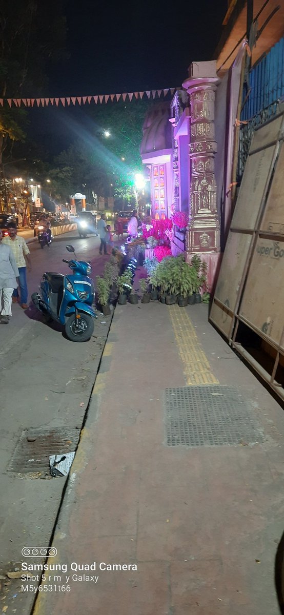 Footpath encroached by putting mandap out side jain temple at MG Road vile parle east mumbai, people are forced to walk on busy road