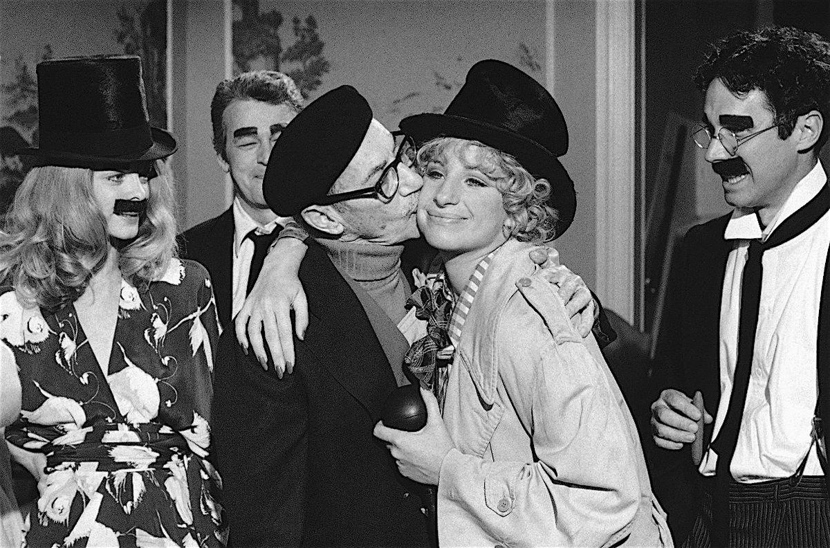 A very happy 82nd birthday to Barbra Streisand! She's shown here, dressed as Harpo, getting a kiss of an 'unidentified elderly admirer' on the set of 'The Way We Were' in the fall of 1972. Dressed as Groucho are Susan Blakely, Murray Hamilton and Bradford Dillman. Groucho was 82.