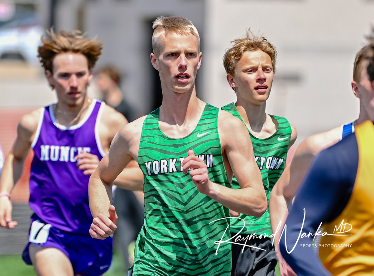 Yorktown Tigers Distance Runner Duo Jonathan Loney and Wyatt Turner pace themselves with the leaders as they round turn two in the 1600 meter run during the Muncie Central Relays @YHSAthletics @YHSDistance @Tiger_Track