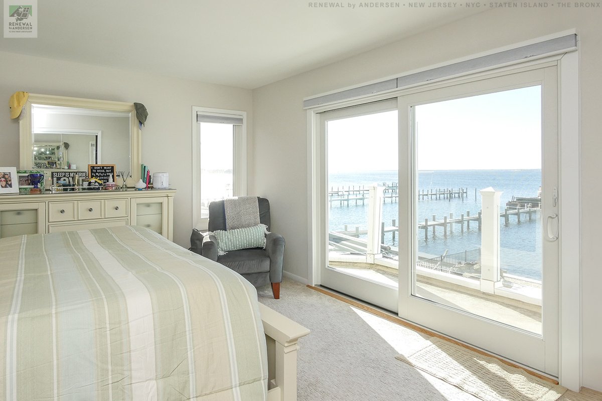 Delightful bedroom with stunning view through a large new patio door &amp; window we installed
. . . . . . . . . .
Find out how easy it is to get new doors &amp; windows for your home -- Contact Us Today: (844) 245-2799 -- Renewal by Andersen New Jersey, NYC, Staten Island and The Bronx