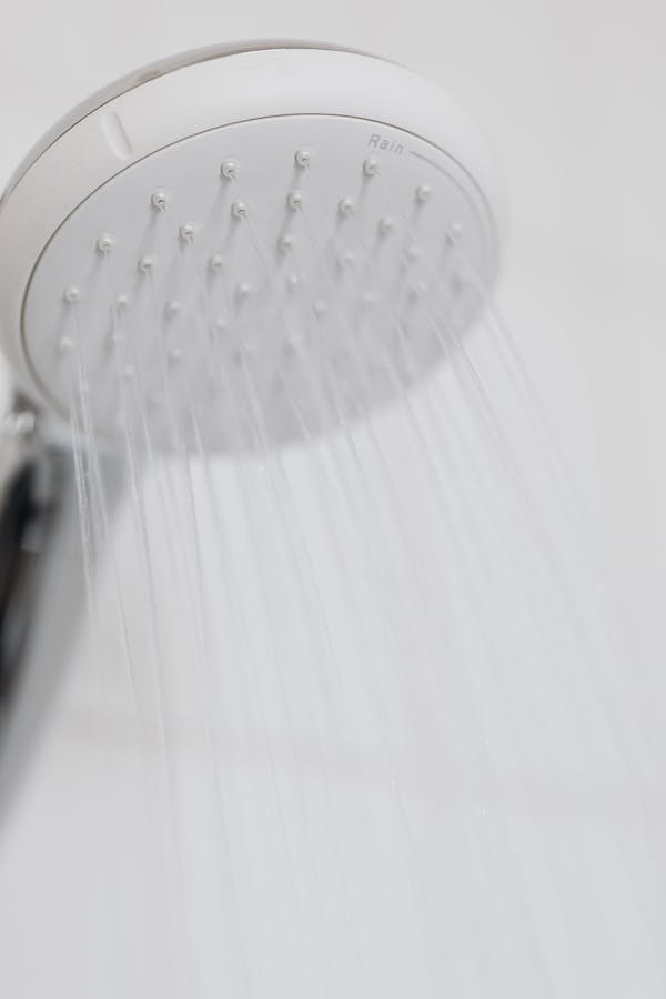 Eskom_SA's tweet photo. A shower uses less water than bathing and, if you use a water-efficient shower head, you are doubling your efforts to save hot water, which means less work for the geyser. #BeEnergyEfficient #SaveEnergy #SaveWater https://t.co/cdT6KpotmK