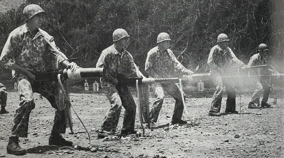 US Marines training on hipfiring the water-cooled Browning M1917 and the air-cooled Browning M1919 .30 caliber machine guns. (Pacific, 1942-43).