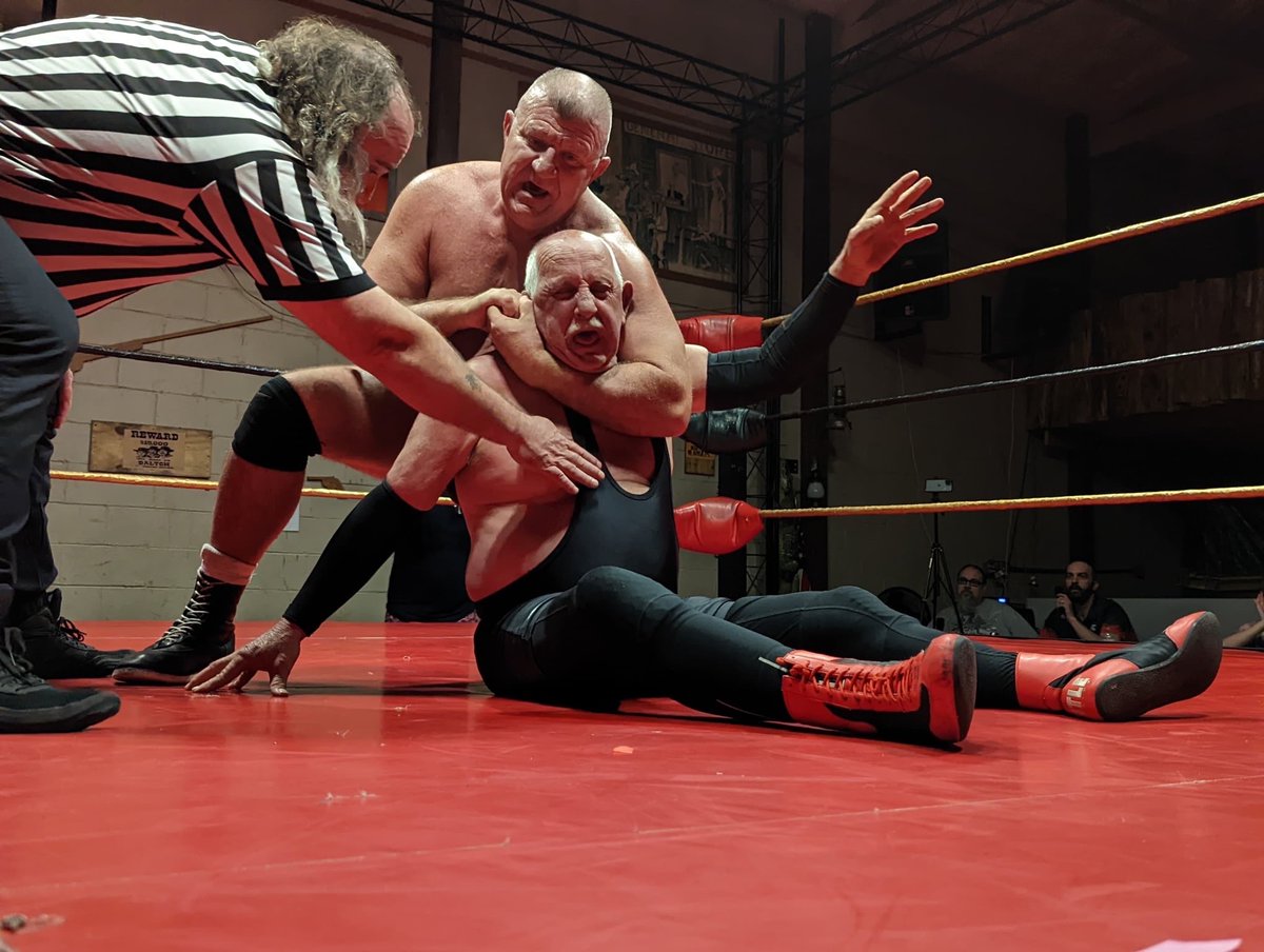 One of Roscoe's favorite photos. From OCW's original 'This Means War' event 3/26/2022. Roscoe with a rear chin lock on Chief Hill as referee Sean Berryman checks in with the Chief.  Video  youtube.com/watch?v=y_p1zG… #outtacontrolwrestling #outtacontrolfan