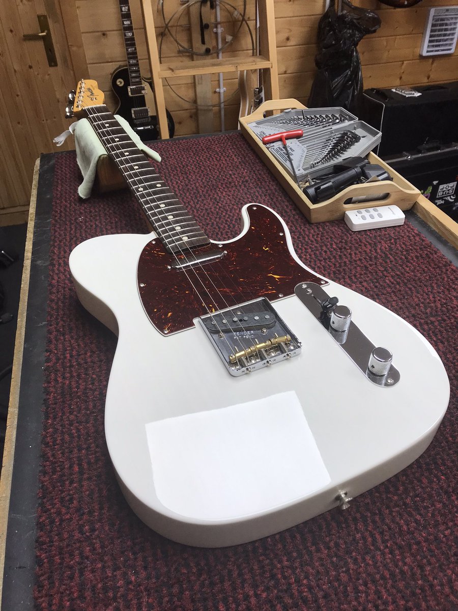 Strat body having Olympic white nitro applied in booth, then same strat flatted, polished &amp; assembled with mint pickguard. 67 strat in for assembly &amp; setup. Jimmy Page telecaster fret dressed, setup &amp; pick guard replaced with tortoiseshell #fenderguitars