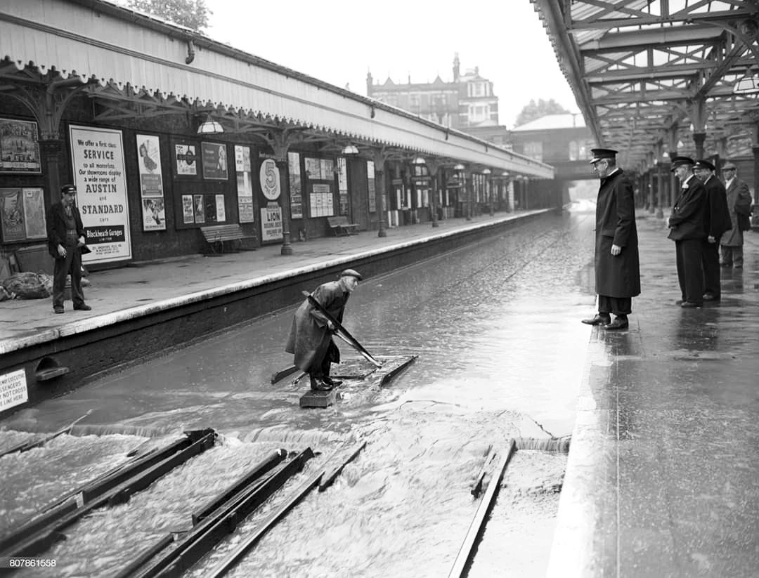 Water, water everywhere: the great storm of 1958

Railway lines under water as torrential rain flood Blackheath station in London causing trains to be diverted.