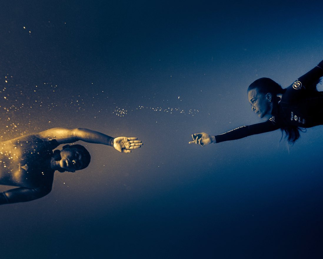 Duality below the waves. Freedivers @alessia.zecchini & @deansevilleno 📷 @below.the.wave #DeeperBlueGram