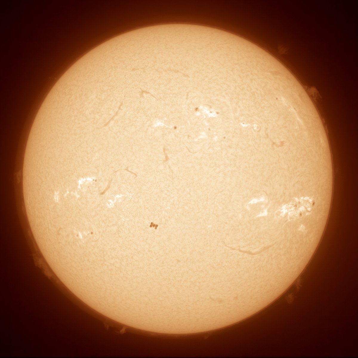 🌞✨ It's not a sunspot, it's the International Space Station! 🛰 Astrophotographer Kevin Gill seized the perfect moment during his lunch break to capture this breathtaking transit of the ISS across the Sun. #SpaceStation #Astrophotography