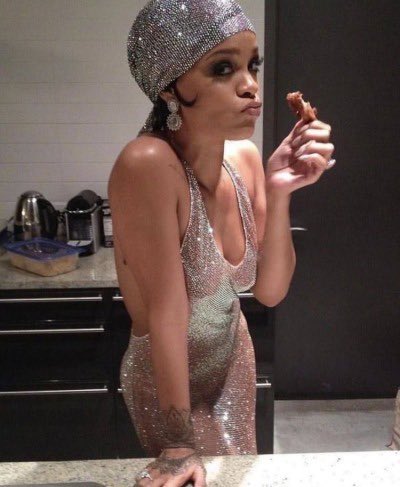 rihanna eating a chicken wing while wearing her swarovski crystals covered dress, 2014