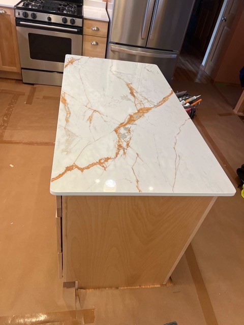 Why choose 1 when you can have 2?
Stunning countertop options come in a variety of patterns, colors and styles. Stop into the showroom today to coordinate your dream kitchen today!

Island- Dekton in color Awake
Counter- Silestone in Ethereal Glow