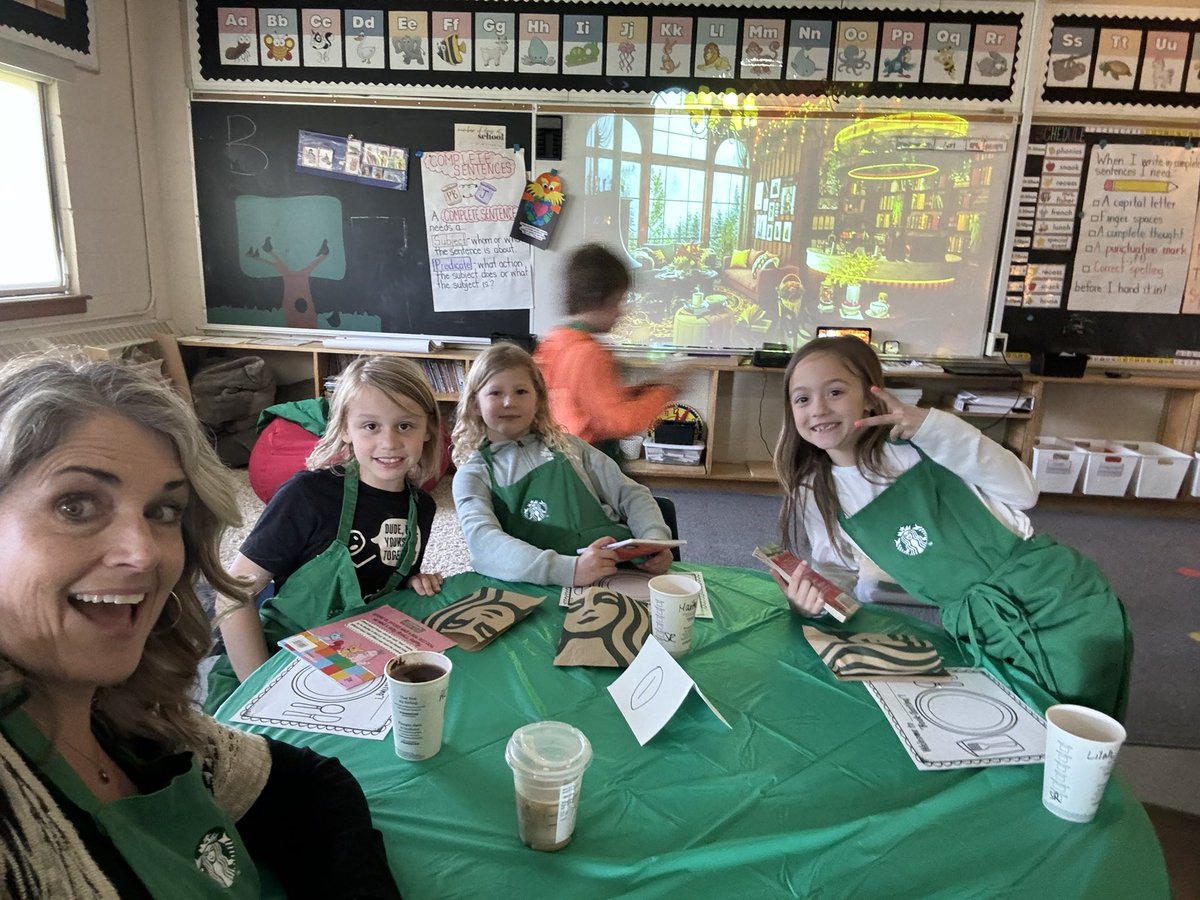 HealeyHeather's tweet photo. When students ask why they can’t have Starbucks at school, Ms.Murphy agreed to give them the whole experience! Book Tasting and Baristas! Thanks for the aprons and cups, @StarbucksCanada @alcdsb_olmc https://t.co/5QHQMdyTDT