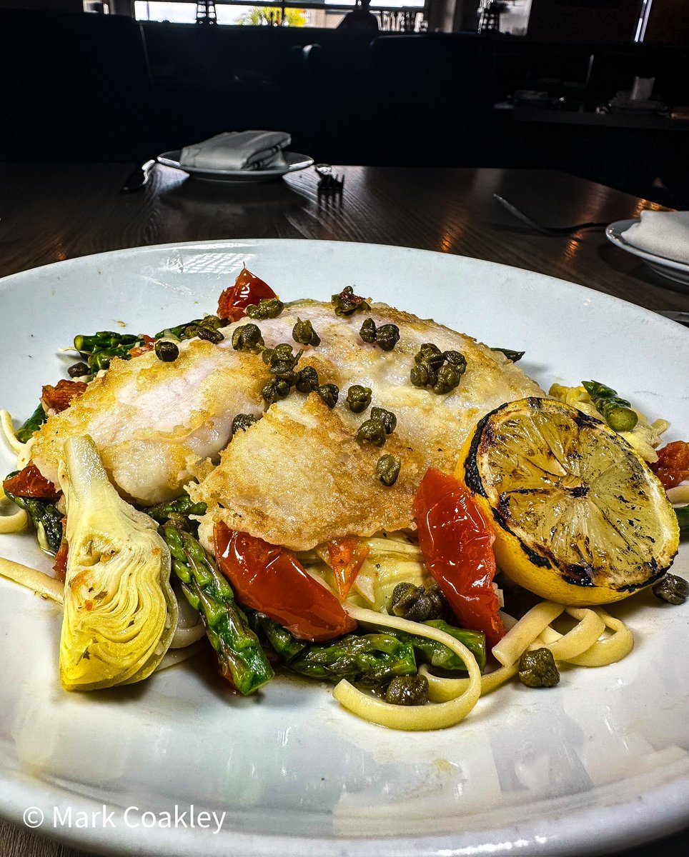 Tilapia Toscana! Savor every bite of tender tilapia, artichokes, tomatoes, and asparagus in a zesty lemon butter sauce with crispy fried capers. #TilapiaToscana #FoodieDelight #LimitedTimeOffer”