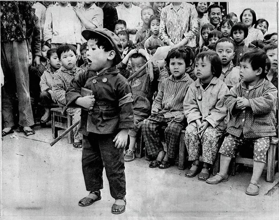 Little Maoist children swearing allegiance to the Little Red Book. Communists always go after the children.