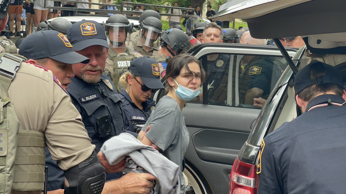 robinmonotti's tweet photo. 🇺🇸 AUSTIN TEXAS - Cowardly police pick on a young girl and arrest her, a peaceful anti-genocide student demonstrator at the University of Texas arrested for having a conscience and freedom of speech. https://t.co/FbUfQd1vST
