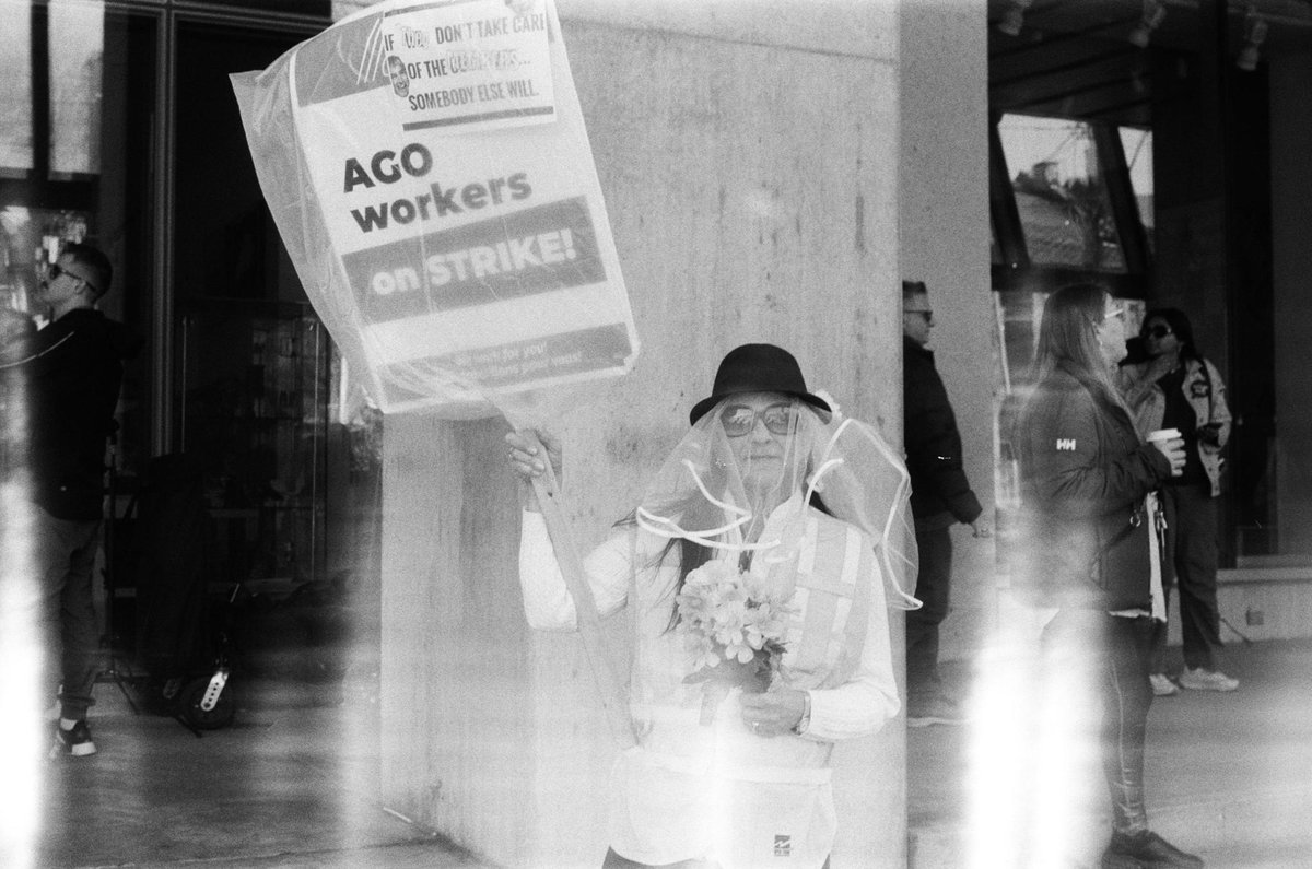 OPSEU's tweet photo. On the one month AGO strike anniversary, we're sharing some tender photos by @shawnclarke capturing the daily intimacies of the picket line on 35 mm film. Strikes an unforgettable experience forging unique comradery — but it helps to have a beautiful visual archive! #NoDealNoAGO https://t.co/4Jo0OOC26S