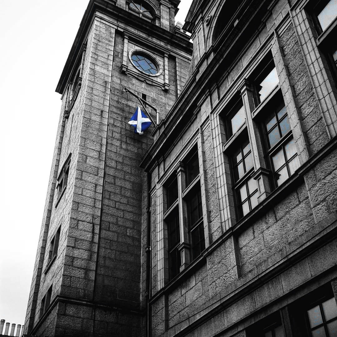 A wee bit harder but the building is a big clue to where this is. I took this photo in 2016. I spotted the saltire by accident, but I love this photo... where was I? If you can name the street, even better.