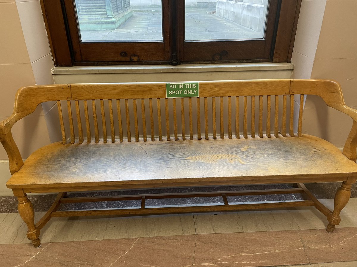 The old Cuyahoga County courthouse is full of signs, including these on two benches in the basement: “Sit in this spot only.” A discovery from an afternoon searching for court records with @RachelDissell.