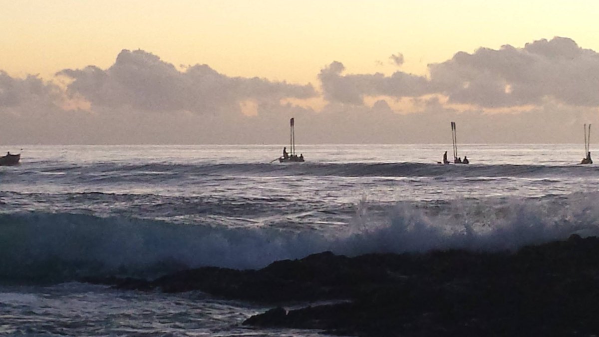 Anzac Day, Currumbin Rocks, a few years ago. Too sick to leave the house today. The ashes of veterans who have died since the last Anzac Day are scattered by the lifesavers. 

We will remember them.