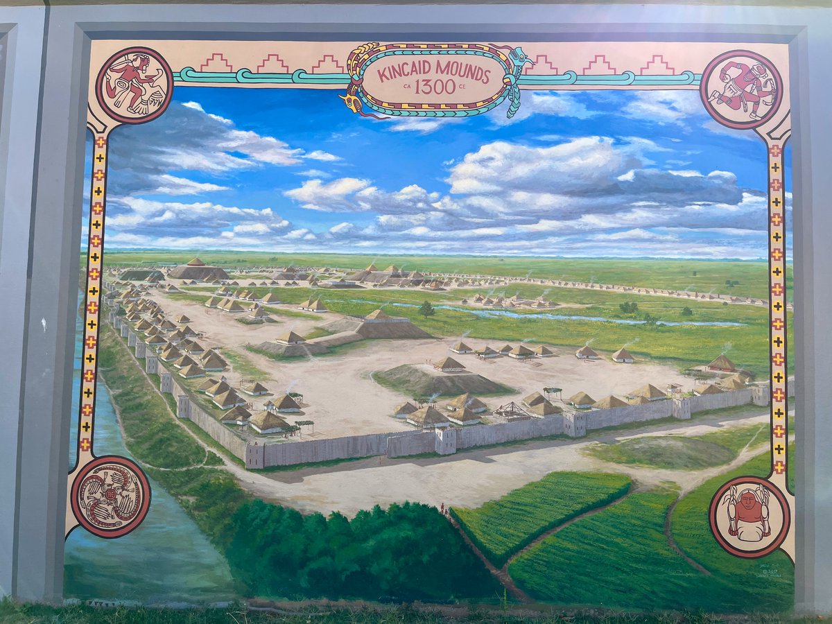 Archaeological reconstruction of the Kincaid Mounds in Illinois at its height around 1300 AD. This painting is on the Ohio River floodwall at Paducah, Kentucky and the Kincaid site is on the other side of the river. Kincaid had a huge protective palisade wall with bastions.