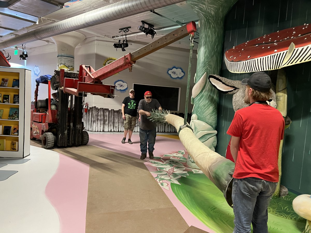 RabbitHoleKC's tweet photo. It took a forklift and 5 people to install the palm tree at the center of our Sam and the Tigers exhibit earlier this week. Now we need to add the palm leaves. 🌴

📗: Sam and the Tigers by Julius Lester &amp; illus by Jerry Pinkney (@penguinkids )

#WIPWednesday https://t.co/pxrHwQWfea