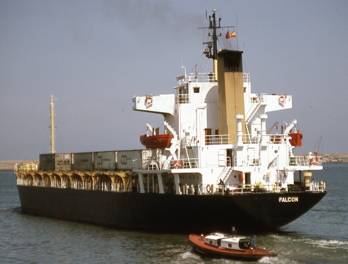 The feeder container ship FALCON seen here outbound from Barcelona in 1988. Built @ #Imabari as BLACK FALCON in 1973. Lengthened in 1981. Scrapped @ #Alang as FEEDER 4 in 2006.