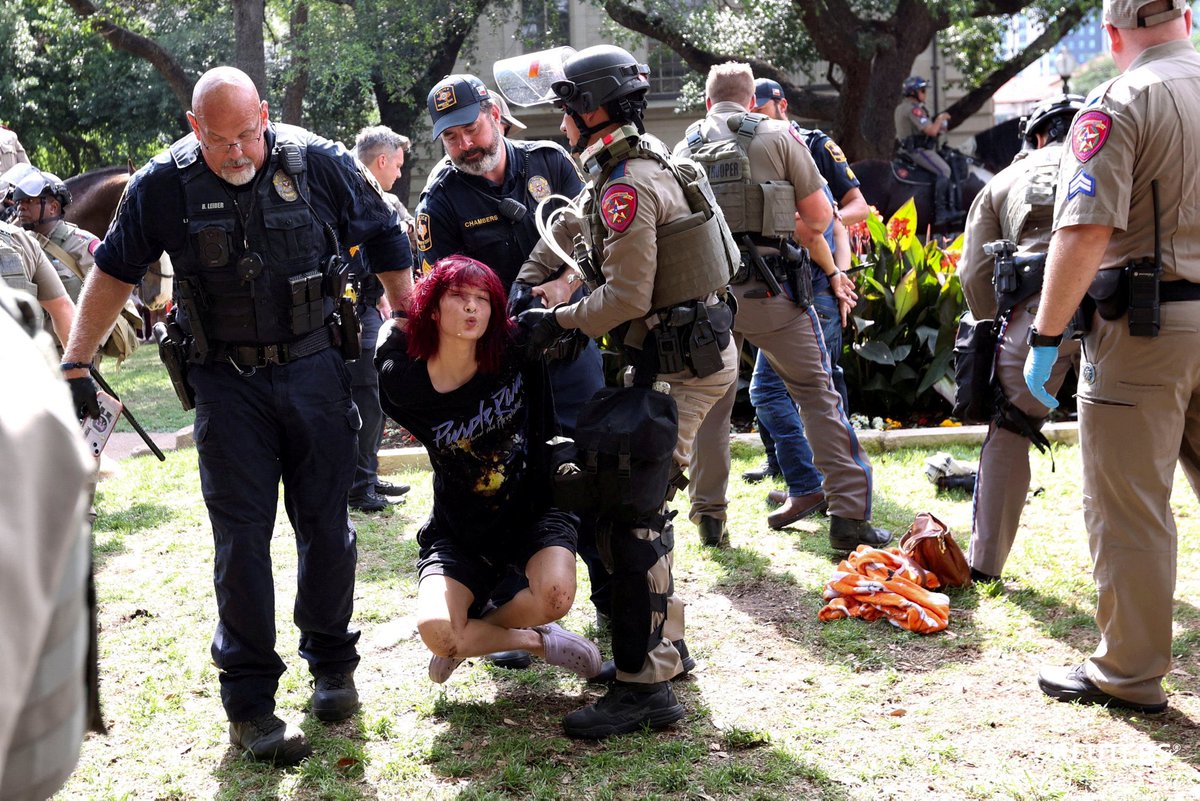 Law enforcement carry a pro-Palestinian protester at the University of Texas in Austin, Texas. Photo by Nuri Vallbona