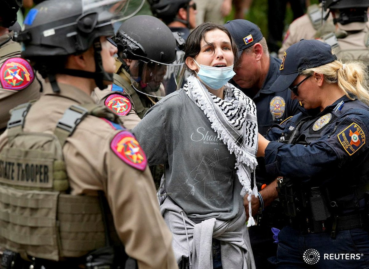 Texas state troopers and University of Texas Police detain a woman at a pro-Palestinian protest at the University of Texas, during the ongoing conflict between Israel and the Palestinian Islamist group Hamas, in Austin, Jay Janner/Austin Statesman/USA Today Network via REUTERS