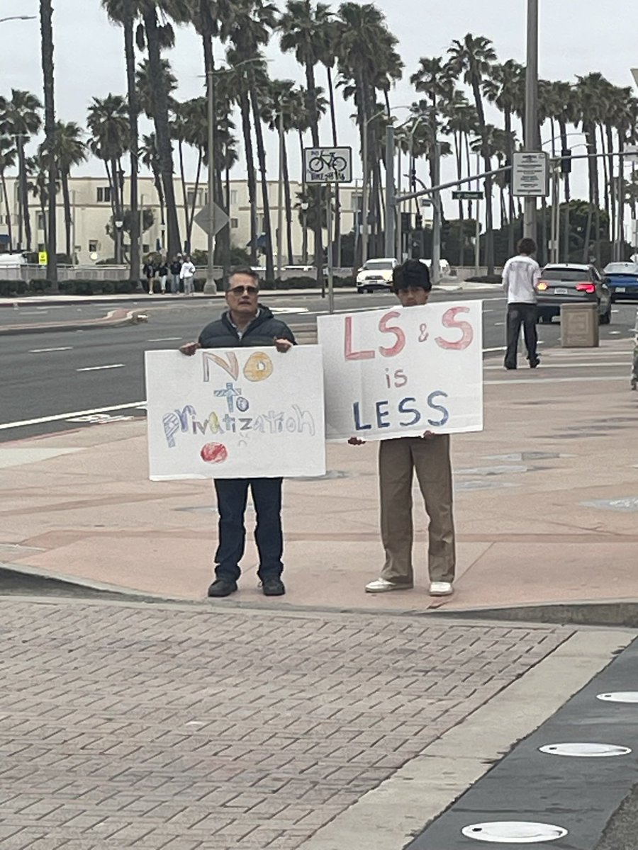 carriedianeinHB's tweet photo. Just a few photos from today’s silent protest on Main St/ PCH. I have an injured knee, so I wasn’t able to walk from the Main St Branch Library. Luckily, I got a good parking spot next to Pier Plaza. I love all the creative, homemade signs! #handsoffourlibrary https://t.co/jlxEzXgOw2
