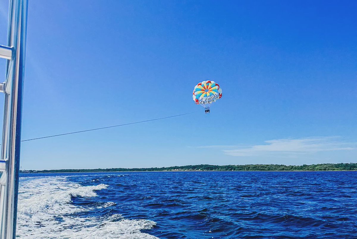 🆙, 🆙, and away! 🪂 Take your vacation to new heights! ☀️ Have you been parasailing before? The thrill, the views, the fresh air... it's an incredible experience! 😎 #TheWayToBeach #ExperiencePcola #LoveFl 📸 @bekki_n from Instagram 🪂 Radical Rides