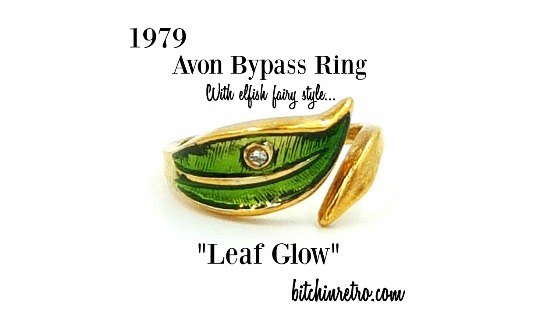 #Avon green enameled leaf ring circa 1979, titled 'Leaf Glow.' This dainty #ring showcases subtle gold veins peeking underneath the #green enameling in a split double #leaf #design; one gold, one green. It has an #elfish, #fairy like feel. #bitchinretro bitchinretro.com/products/avon-…