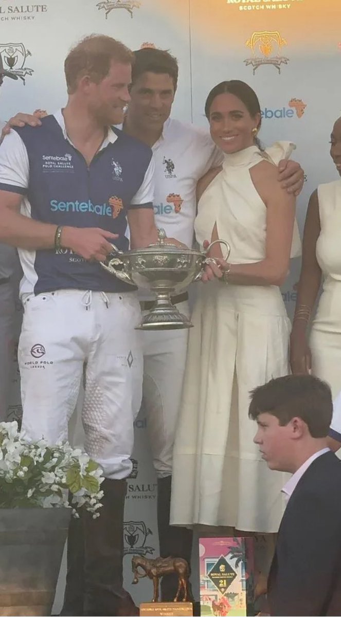 Prince Harry, Nacho Figueras, and Princess Meghan holding the winner's cup.🏆 #SentebalePolo