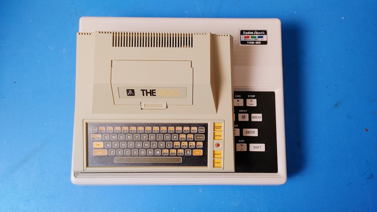 canadianretrot1's tweet photo. A lot of people say how little and cute the #Atari400Mini is. Here it is sitting on my fully functioning #TRS80MC10 from 1984. Not that much smaller. https://t.co/3C9Ck3NczF
