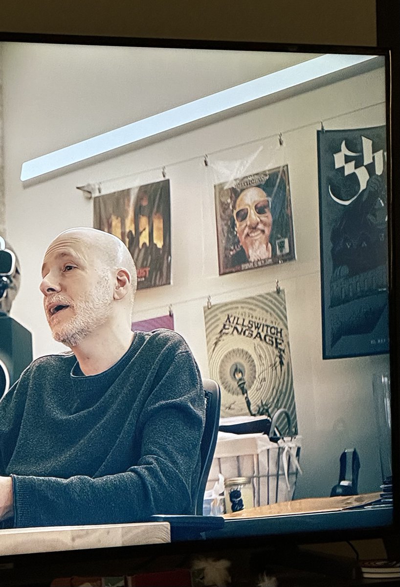ghosttemplatte's tweet photo. GUYS @thebandGHOST had a cameo in the @Nickelback movie!! A crossover I never expected lmao (although there IS a Terzo poster that can be seen during NB’s performances at Bandit Rock) https://t.co/rpgrFRmowV