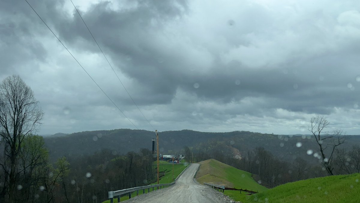 I love the random places my job takes me. Can see probably 100 miles out from the top of this mountain