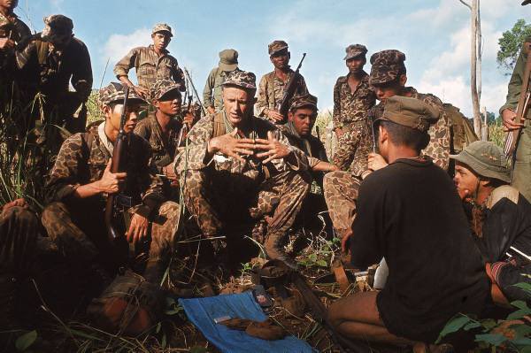 Captain Vernon Gillespie questioning two captured Viet Cong in South Vietnam