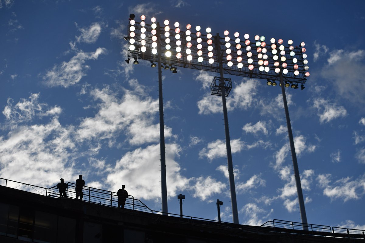 Baseball fans stand on the upper deck as they watch the Oakland Athletics play the Washington Nationals in the first inning of their MLB game at the Coliseum in Oakland, Calif., on Friday, April 12, 2024. #rootedinoakland